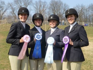 Senior Anna Lotts, juniors Melissa Colby and Christina Iacovino, and senior Megan LaFollette pose for a picture during show weekend. Photo courtesy of Julie Lotts.