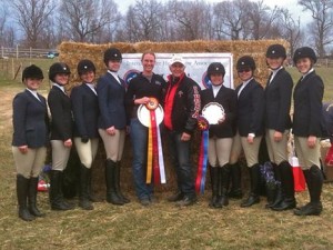 The girls who qualified for regionals (Christina Iacovino, Melissa Colby, Jenna Hurty, Jennifer Marks, Elizabeth Miller, Annina McMillan, and Anna Lotts) pose for a photo with Coach Emily Costello and IHSA founder Bob Cacchione.