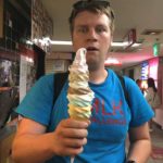 Nick Wagner holding an 8 layer ice cream cone