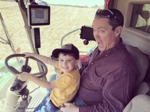 My nephew driving the tractor with my dad 