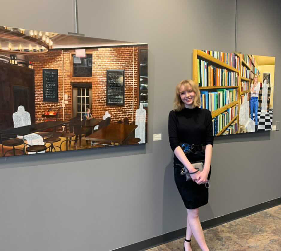 Lindsay Picht in front of her artwork in Columbia